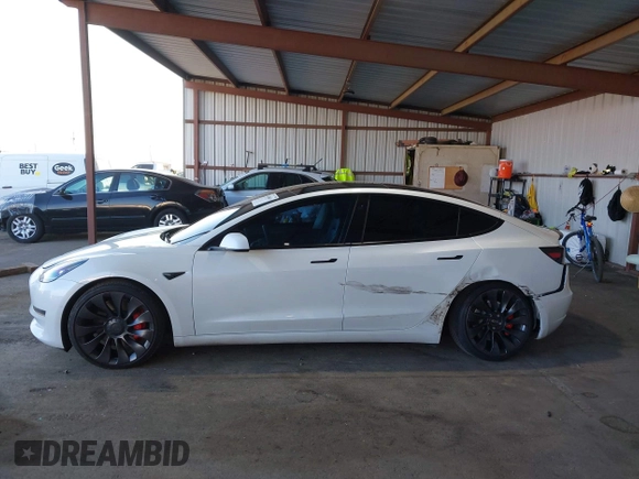 2021 Tesla Model 3 Performance with VIN 5YJ3E1EC4MF097993, listed as a IAAI auction lot 41366615 with 30,735 mi miles and . Bid and sale history available at DreamBid. Image 14.