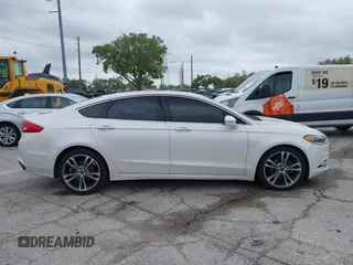 2017 Ford Fusion Titanium with VIN 3FA6P0K99HR272713, listed as a IAAI auction lot 41757334 with 104,733 mi miles. Bid and sale history available at carsss.com. Image 13.
