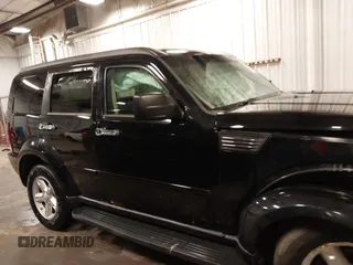 2007 Dodge Nitro SXT with VIN 1D8GU28K67W663621, listed as a IAAI auction lot 41691529 with 211,556 mi miles. Bid and sale history available at carsss.com. Image 14.