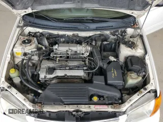 1999 Mazda Protege DX z VIN JM1BJ2224X0173126, wystawiony jako Copart lot #57389245 z przebiegiem 155 534 mil mil oraz Szkoda całkowita • Salvage title. Historia ofert i sprzedaży dostępna na DreamBid. Obrazek 11.
