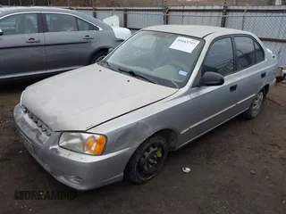 2001 Hyundai Accent GL with VIN KMHCG45C61U156696, listed as a IAAI auction lot 41643757 with 336,344 mi miles. Bid and sale history available at carsss.com. Image 2.