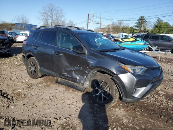 2018 Toyota RAV4 Hybrid SE with VIN JTMJJREV5JD210274, listed as a Copart auction lot 52450645 with 108,249 mi miles and Salvage title. Bid and sale history available at DreamBid. Image 4.