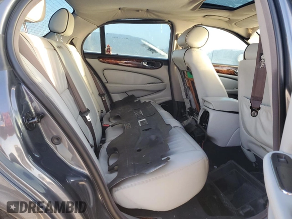 2004 Jaguar XJ with VIN SAJEA74C24SG09038, listed as a Copart auction lot 77015544 with Not Provided miles and Salvage Title. Bid and sale history available at DreamBid. Image 10.