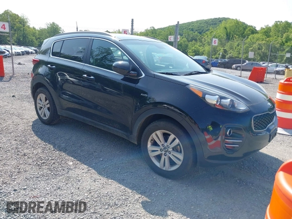 2017 Kia Sportage LX z VIN KNDPMCAC1H7285906, wystawiony jako IAAI lot #42399031 z przebiegiem 142 909 mil mil oraz . Historia ofert i sprzedaży dostępna na DreamBid. Obrazek 1.