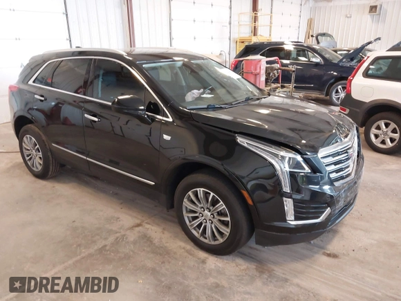2019 Cadillac XT5 Luxury FWD z VIN 1GYKNCRS2KZ197052, wystawiony jako IAAI lot #42242466 z przebiegiem 86 678 mil mil oraz . Historia ofert i sprzedaży dostępna na DreamBid. Obrazek 1.