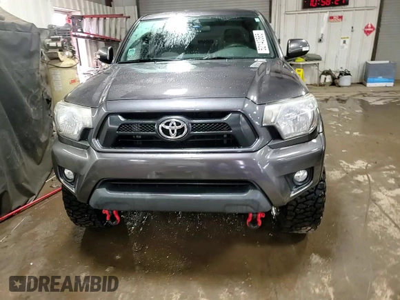 2014 Toyota Tacoma with VIN 5TFLU4ENXEX089927, listed as a Copart auction lot 52140565 with 112,924 mi miles and Salvage Title. Bid and sale history available at DreamBid. Image 13.