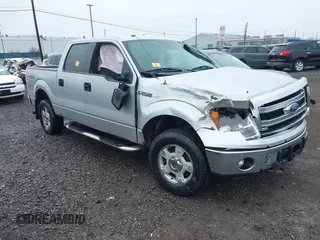 2014 Ford F-150 XL with VIN 1FTFW1EFXEKF79876, listed as a IAAI auction lot 42011856 with 161,366 mi miles and . Bid and sale history available at carsss.com. Image 1.