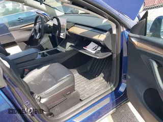 2023 Tesla Model Y Long Range with VIN 7SAYGDEE7PF702051, listed as a IAAI auction lot 42074182 with 50,473 mi miles and . Bid and sale history available at DreamBid. Image 5.