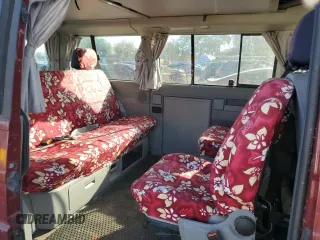 2003 Volkswagen EuroVan MV с VIN WV2NB47013H001081, выставлен на аукционе Copart как лот 82126354 с пробегом 158 433 миль миль и Чистый • Clean title. История ставок и продаж доступна на DreamBid. Изображение 11.