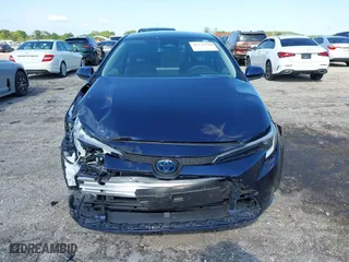 2024 Toyota Corolla Hybrid LE with VIN JTDBCMFE4RJ021466, listed as a IAAI auction lot 41976149 with 21,965 mi miles. Bid and sale history available at carsss.com. Image 12.