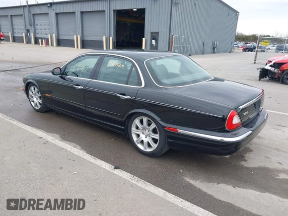 2004 Jaguar XJ with VIN SAJWA71C14SG20122, listed as a IAAI auction lot 41685767 with 113,392 mi miles. Bid and sale history available at carsss.com. Image 3.