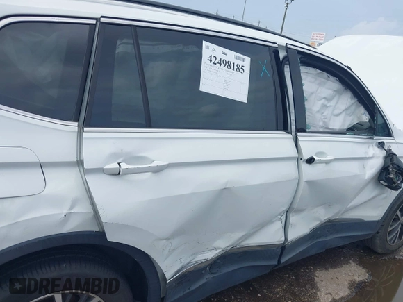 2018 Volkswagen Tiguan SEL with VIN 3VV2B7AX3JM199908, listed as a IAAI auction lot 42498185 with 58,540 mi miles and . Bid and sale history available at DreamBid. Image 6.