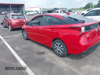 2021 Toyota Prius LE with VIN JTDL9MFU0M3029880, listed as a IAAI auction lot 42450003 with 91,558 mi miles and . Bid and sale history available at DreamBid. Image 3.
