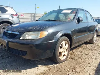 2001 Mazda Protege LX with VIN JM1BJ225410469975, listed as a IAAI auction lot 42035389 with 252,022 mi miles. Bid and sale history available at carsss.com. Image 2.