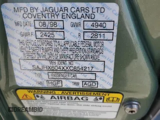 1999 Jaguar XJ with VIN SAJHX604XXC854217, listed as a Copart auction lot 56042735 with 127,092 mi miles and Salvage title. Bid and sale history available at DreamBid. Image 12.