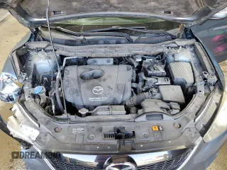 2015 Mazda CX-5 Sport with VIN JM3KE4BY9F0552942, listed as a Copart auction lot 54750245 with 129,700 mi miles and Salvage title. Bid and sale history available at DreamBid. Image 12.