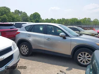 2014 Mazda CX-5 Sport with VIN JM3KE4BE9E0411177, listed as a IAAI auction lot 42411938 with 167,709 mi miles and . Bid and sale history available at DreamBid. Image 13.
