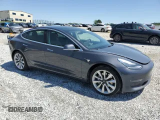2019 Tesla Model 3 Mid Range z VIN 5YJ3E1EA7KF397524, wystawiony jako Copart lot #52696585 z przebiegiem 82 995 mil mil oraz Szkoda całkowita • Salvage title. Historia ofert i sprzedaży dostępna na DreamBid. Obrazek 4.