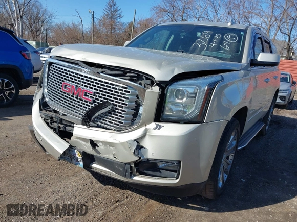 2016 GMC Yukon Denali with VIN 1GKS2CKJ5GR393269, listed as a IAAI auction lot 41963630 with 158,584 mi miles and . Bid and sale history available at DreamBid. Image 6.