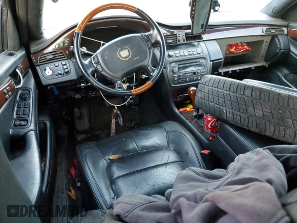 2003 Cadillac DeVille DTS z VIN 1G6KF57963U245281, wystawiony jako Copart lot #79911554 z przebiegiem Nie podano mil oraz Szkody całkowita. Historia ofert i sprzedaży dostępna na DreamBid. Obrazek 8.