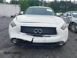 2014 Infiniti QX70 z VIN JN8CS1MU7EM451246, wystawiony jako IAAI lot #42221306 z przebiegiem 190 252 mil mil oraz . Historia ofert i sprzedaży dostępna na DreamBid. Obrazek 12.