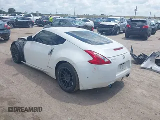 2012 Nissan 370Z z VIN JN1AZ4EH5CM564517, wystawiony jako IAAI lot #42385869 z przebiegiem 55 359 mil mil oraz . Historia ofert i sprzedaży dostępna na DreamBid. Obrazek 3.