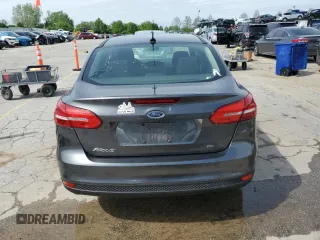 2018 Ford Focus SE z VIN 1FADP3F24JL204488, wystawiony jako Copart lot #54733625 z przebiegiem Nie podano mil oraz Szkoda całkowita • Salvage title. Historia ofert i sprzedaży dostępna na DreamBid. Obrazek 6.