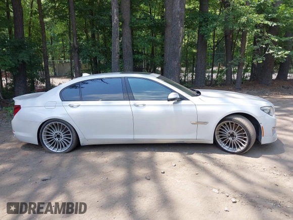 2013 BMW 7 Series 750Li with VIN WBAYE8C55DDS16013, listed as a IAAI auction lot 42709519 with 123,405 mi miles and . Bid and sale history available at DreamBid. Image 13.
