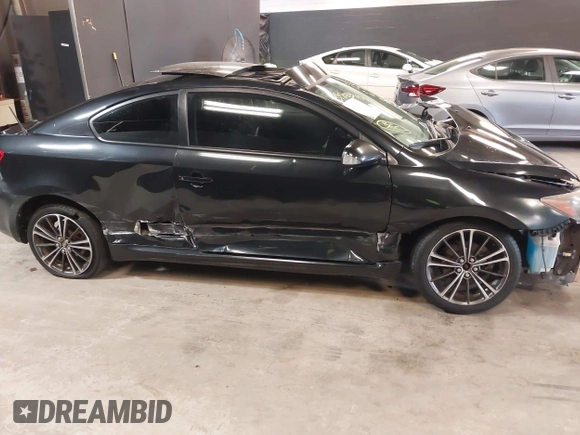 2010 Scion tC with VIN JTKDE3B77A0320585, listed as a IAAI auction lot 39883404 with 140,409 mi miles. Bid and sale history available at carsss.com. Image 14.