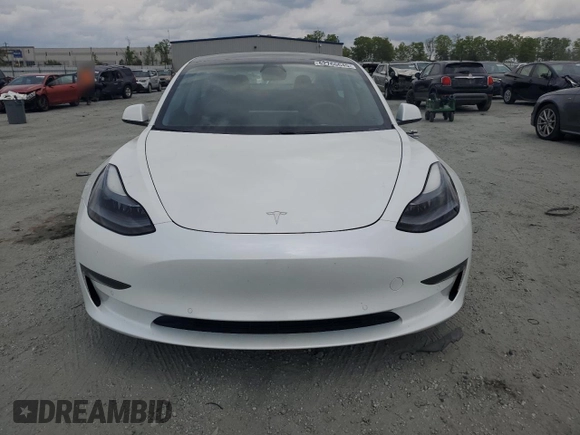 2021 Tesla Model 3 Standard Range Plus z VIN 5YJ3E1EAXMF973450, wystawiony jako Copart lot #52766645 z przebiegiem 66 827 mil mil oraz Szkoda całkowita • Salvage title. Historia ofert i sprzedaży dostępna na DreamBid. Obrazek 5.
