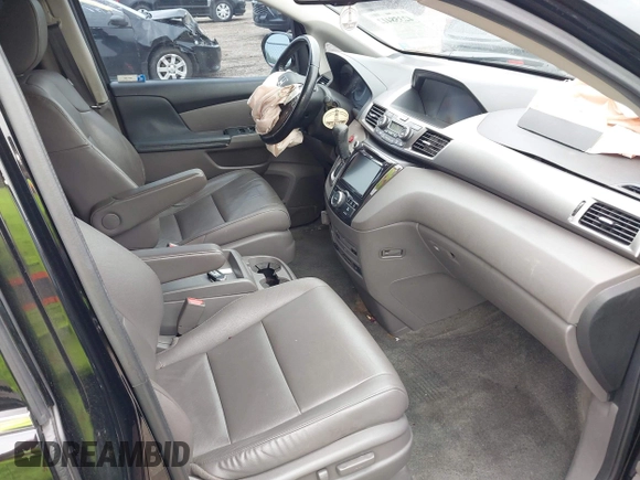 2015 Honda Odyssey Touring Elite with VIN 5FNRL5H97FB124565, listed as a IAAI auction lot 42358412 with 206,444 mi miles and . Bid and sale history available at DreamBid. Image 5.