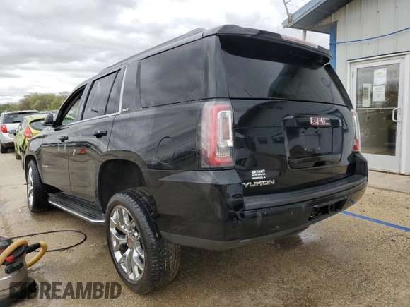 2015 GMC Yukon SLT z VIN 1GKS2BKC1FR112708, wystawiony jako Copart lot #53963165 z przebiegiem 123 331 mil mil oraz Szkoda całkowita • Salvage title. Historia ofert i sprzedaży dostępna na DreamBid. Obrazek 2.