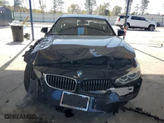 2015 BMW 4 Series 428i xDrive with VIN WBA4C9C53FD330038, listed as a Copart auction lot 77094584 with 123,906 mi miles and Salvage Title. Bid and sale history available at carsss.com. Image 5.