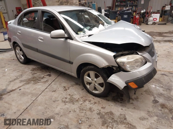 2009 Kia Rio LX with VIN KNADE223596444133, listed as a IAAI auction lot 41598865 with Not Provided miles and . Bid and sale history available at DreamBid. Image 1.