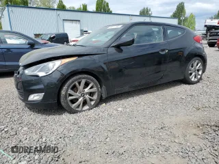 2013 Hyundai Veloster w/Gray Int z VIN KMHTC6AD8DU096107, wystawiony jako Copart lot #56072185 z przebiegiem 100 351 mil mil oraz Czysty tytuł • Clean title. Historia ofert i sprzedaży dostępna na DreamBid. Obrazek 1.