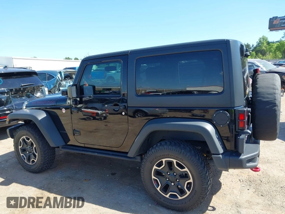 2015 Jeep Wrangler Rubicon Hard Rock with VIN 1C4BJWCG1FL610028, listed as a IAAI auction lot 42318569 with 48,627 mi miles and . Bid and sale history available at DreamBid. Image 14.