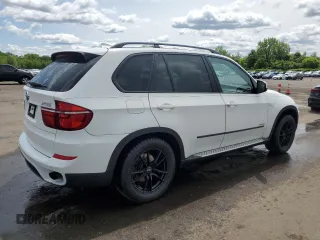 2012 BMW X5 35i with VIN 5UXZV4C54CL763857, listed as a Copart auction lot 57943195 with 143,522 mi miles and Salvage title. Bid and sale history available at DreamBid. Image 3.