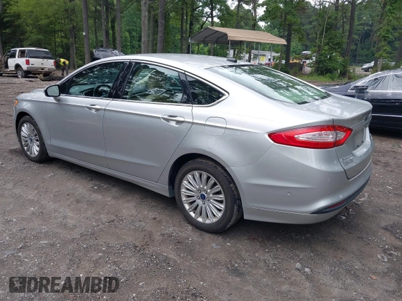 2013 Ford Fusion SE Hybrid z VIN 3FA6P0LU1DR291060, wystawiony jako IAAI lot #42731674 z przebiegiem 93 918 mil mil oraz . Historia ofert i sprzedaży dostępna na DreamBid. Obrazek 3.