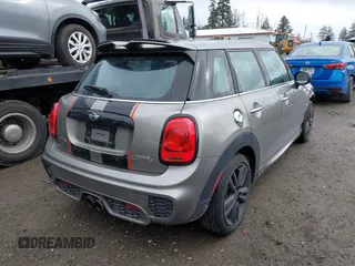 2017 MINI Hardtop 4 Door Cooper S z VIN WMWXU3C58H2D33073, wystawiony jako IAAI lot #41913081 z przebiegiem 51 631 mil mil oraz . Historia ofert i sprzedaży dostępna na DreamBid. Obrazek 4.