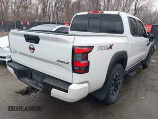 2022 Nissan Frontier SV z VIN 1N6ED1EJ2NN646035, wystawiony jako IAAI lot #41702459 z przebiegiem 93 030 mil mil oraz . Historia ofert i sprzedaży dostępna na DreamBid. Obrazek 4.