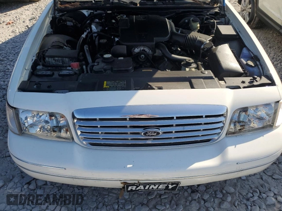 2004 Ford Crown Victoria LX z VIN 2FDFP74W34X164453, wystawiony jako Copart lot #75922204 z przebiegiem 103 546 mil mil oraz Szkoda całkowita • Salvage title. Historia ofert i sprzedaży dostępna na DreamBid. Obrazek 12.