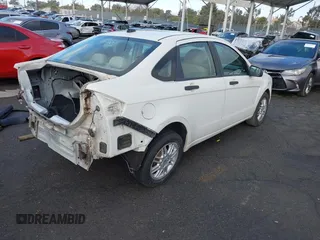 2010 Ford Focus SE with VIN 1FAHP3FN5AW146403, listed as a IAAI auction lot 40955575 with 128,243 mi miles. Bid and sale history available at carsss.com. Image 4.