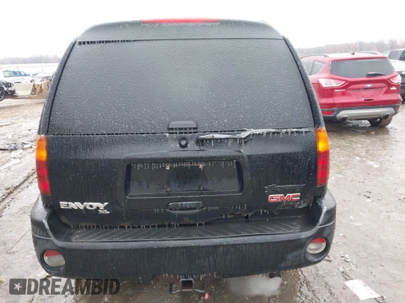 2005 GMC Envoy XL SLE with VIN 1GKET16S156160473, listed as a IAAI auction lot 41510661 with 233,942 mi miles. Bid and sale history available at carsss.com. Image 16.