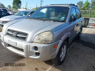2006 Hyundai Tucson GL with VIN KM8JM12B26U469326, listed as a IAAI auction lot 42204742 with 240,998 mi miles. Bid and sale history available at carsss.com. Image 2.