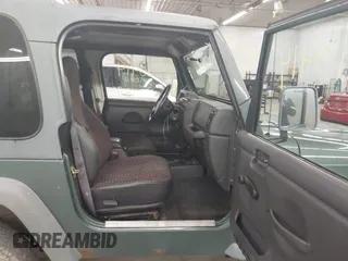 1999 Jeep Wrangler Sport with VIN 1J4FY19S0XP496555, listed as a IAAI auction lot 42110414 with 125,500 mi miles. Bid and sale history available at carsss.com. Image 5.