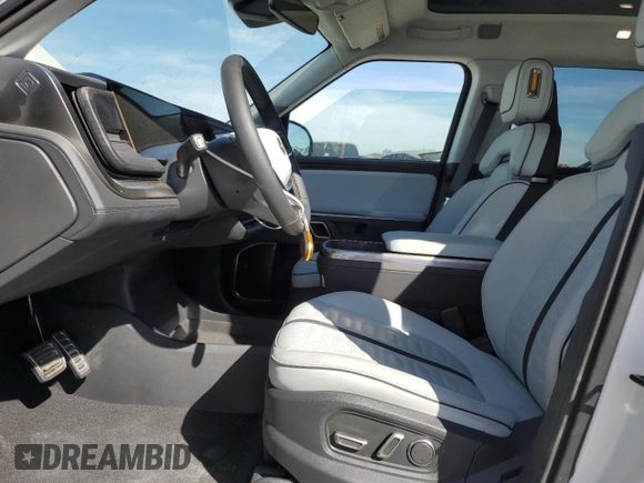 2024 Rivian R1T Adventure z VIN 7FCTGCAA9RN030318, wystawiony jako Copart lot #77036474 z przebiegiem 3 522 mil mil oraz Szkoda całkowita • Salvage title. Historia ofert i sprzedaży dostępna na DreamBid. Obrazek 7.