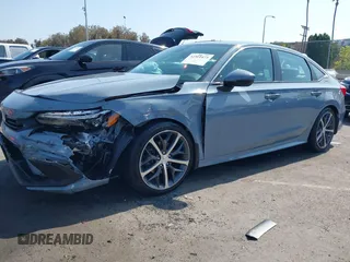2023 Honda Civic Touring with VIN 2HGFE1F92PH322377, listed as a IAAI auction lot 42361473 with 43,533 mi miles and . Bid and sale history available at DreamBid. Image 2.