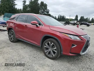 2018 Lexus RX 450hL Premium with VIN JTJDGKCA5J2002701, listed as a Copart auction lot 60258935 with 73,437 mi miles and Salvage title. Bid and sale history available at DreamBid. Image 4.