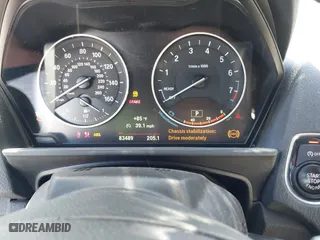2015 BMW 2 Series 228i with VIN WBA1K5C50FV474011, listed as a IAAI auction lot 41805879 with 83,489 mi miles. Bid and sale history available at carsss.com. Image 6.
