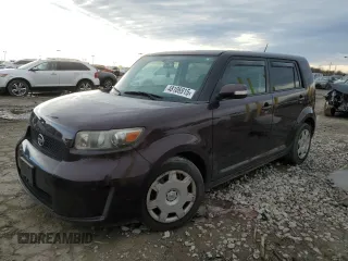 2010 Scion xB with VIN JTLZE4FE7A1105136, listed as a Copart auction lot 48106915 with 118,509 mi miles and Salvage Title. Bid and sale history available at carsss.com. Image 1.